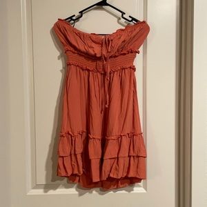 Burnt orange, strapless dress.